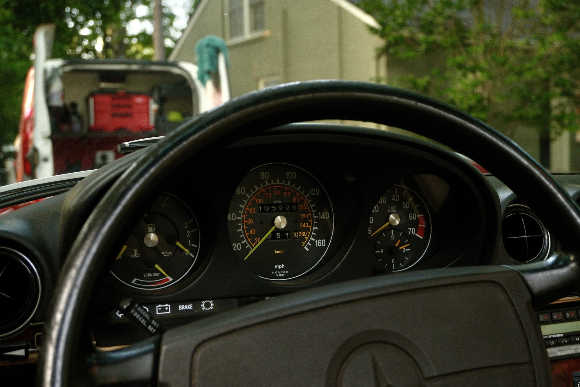 Clean classic car cockpit with the Every Detail van visible outside