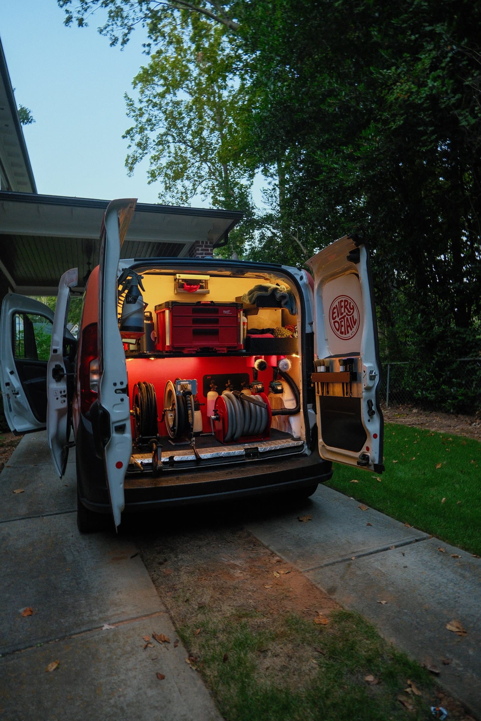 Every Detail mobile detailing van open and fully set up in a residential driveway
