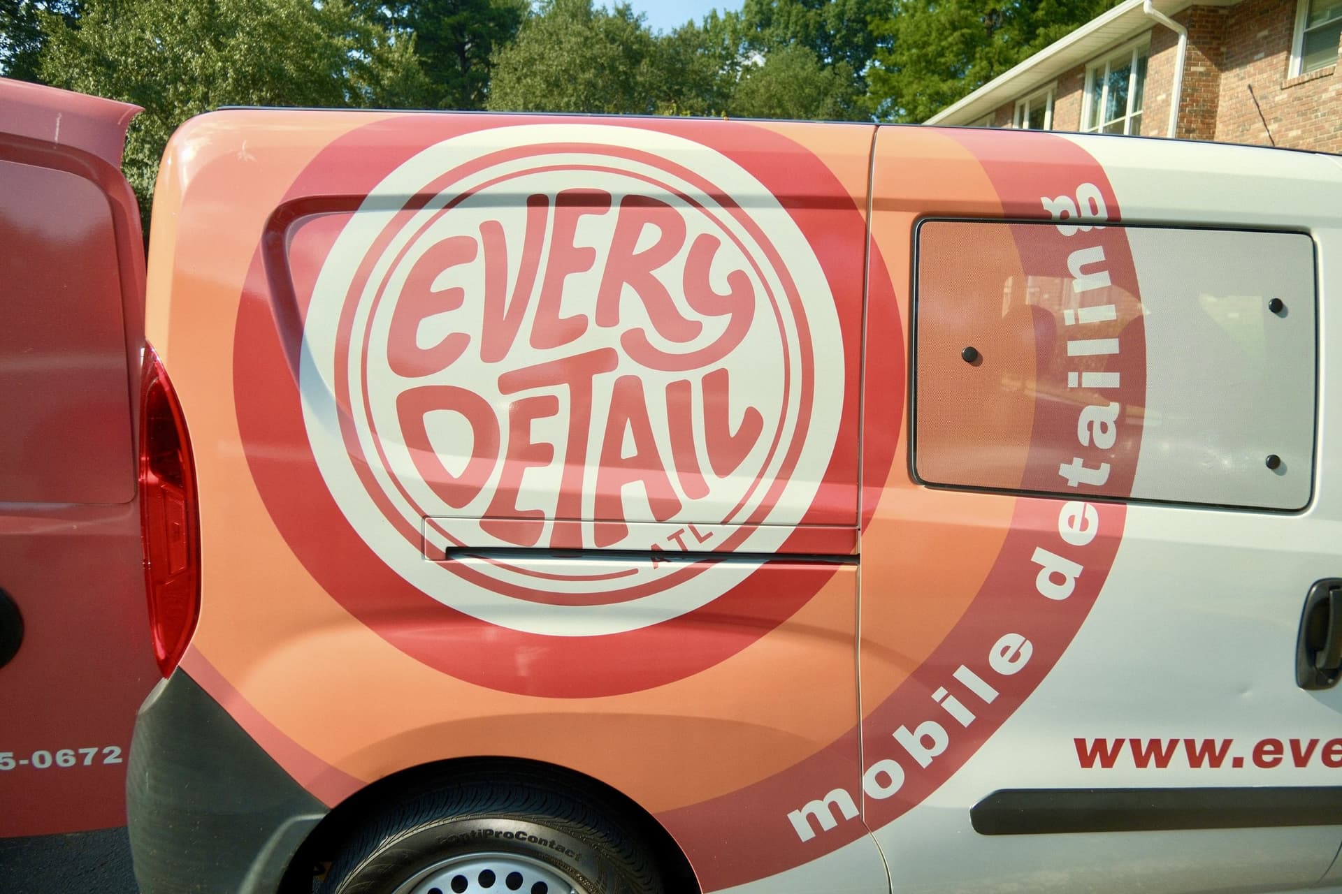 Every Detail branded mobile detailing van parked at a local job